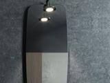 a black and white mirror with a light on it