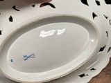 a person that is holding a plate on a table