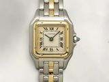 an image of a silver and gold wrist watch with roman numerals