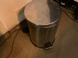 an image of a trash can next to a tv
