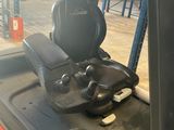 an image of a forklift with a seat on the back of it
