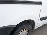 a white van with a black stripe on the side of it