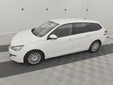 a picture of a white car parked in a garage