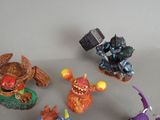five figurines of different characters on a table