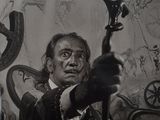 black and white photograph of a man holding a gun in front of a painting