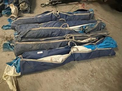 many bags of luggage sitting on the floor in the garage