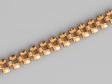 a close up of a gold bracelet on a gray surface