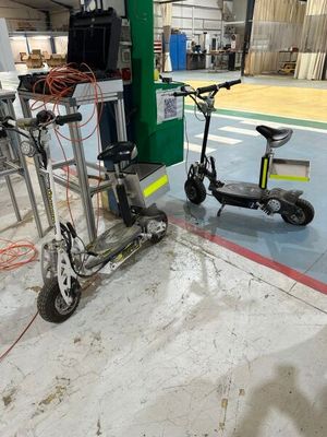 a scooter and a scooter in a warehouse