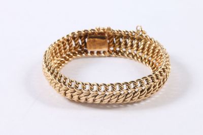 a close up of a gold chain bracelet on a white background
