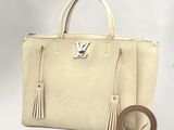 louis vuitton beige leather tote bag with tassels