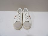 pair of white sneakers on a white surface with a white background