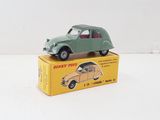 a green toy car sitting on top of a yellow box