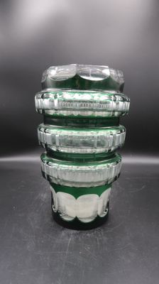 a stack of glass containers sitting on top of a table