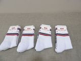 four pairs of white socks with red, white, and blue stripes