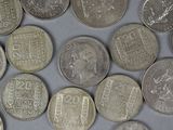 a lot of coins that are sitting on a table