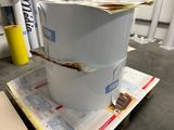 a stack of papers sitting on top of a stack of boxes