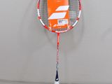 a tennis racket with a package on it