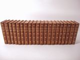 a stack of old books sitting on top of each other