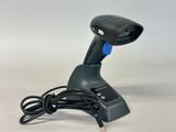 a close up of a barcode scanner on a white surface