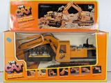 a box with a toy construction vehicle in it