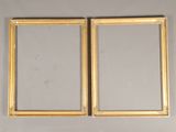 pair of antique gold picture frames on a white wall