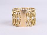 a close up of a gold ring with diamonds on a white background