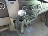 a close up of a car ' s dashboard with a gear lever