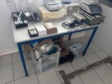 a table with a bunch of electronic equipment on it