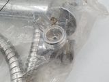 a silver hose that is wrapped in plastic on a table