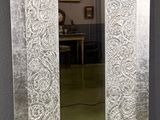 a mirror that is sitting on the floor in a room