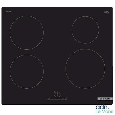 a close up of a black stove top with four burners