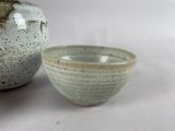 two bowls sitting next to each other on a table