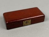 a small wooden box that has a lock on it