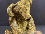 a teddy bear that is sitting on a table