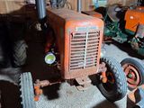a tractor that is sitting in a garage