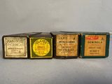 three boxes of old medicine are lined up on a table