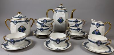 a group of tea and coffee cups and saucers on a table