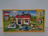 une boîte de Lego Creators contenant une maison
