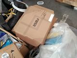 a pile of boxes sitting on the floor in a garage