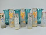 seven vases that have been painted with flowers on them
