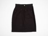 a black skirt on a hanger against a white background