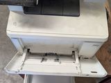 an image of a stack of printer ' s with a monitor on top of it
