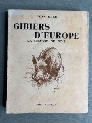 an old book with a picture of a pig on it ' s cover