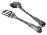 two spoons and a fork on a white surface