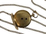 a gold pocket watch on a chain with a chain around it
