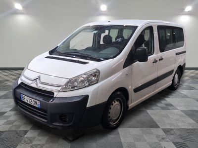a picture of a small white van parked in a room