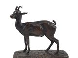 bronze statue of a goat on a marble base on a white background