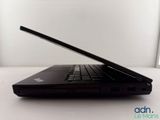 a black laptop sitting on a table with a white background