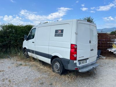 a white van that is parked in the dirt