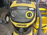 a yellow and black vacuum cleaner sitting on the floor